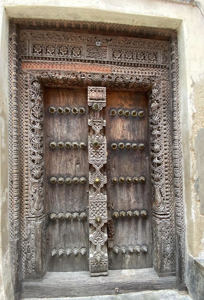 An intricately carved wooden door in Stone Town, Zanzibar